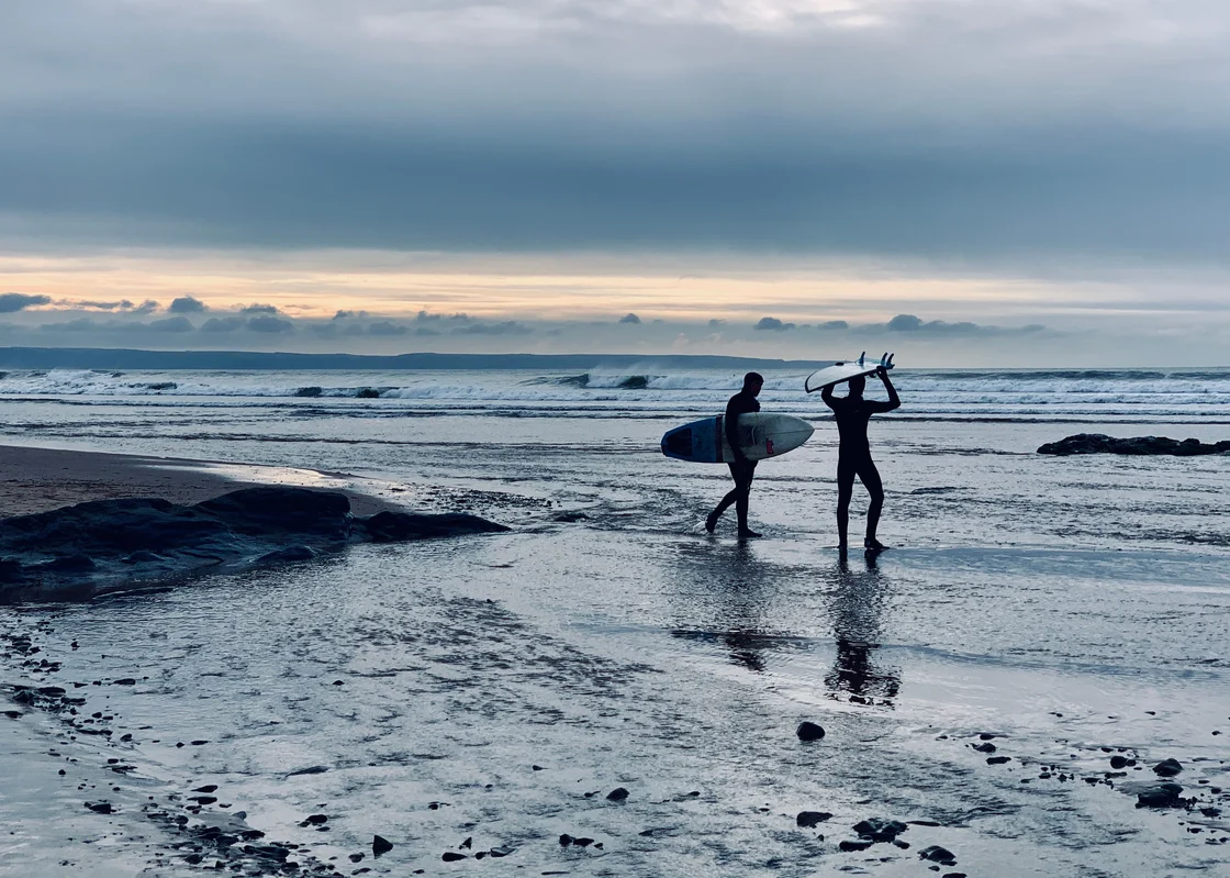 Surfers in North Devon near Croyde Village
